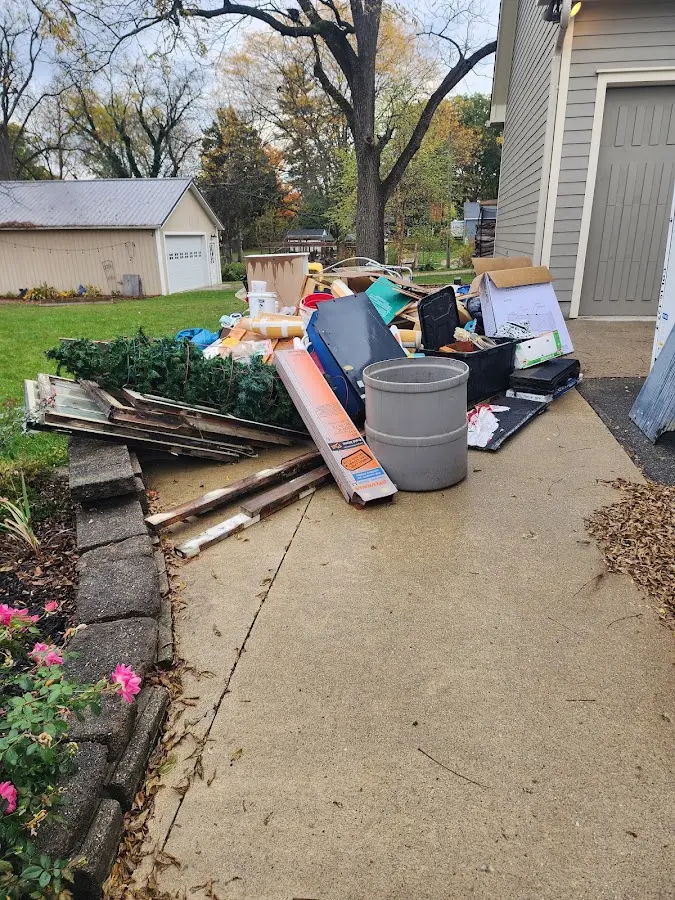 Dumpster being loaded with debris for 10 Yard Dumpster Rental in Leisure World